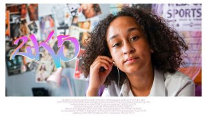 Poster for 2k5 featuring a young black girl is staring into the camera while putting in a wired headphone in front of a bedroom wall full of music posters